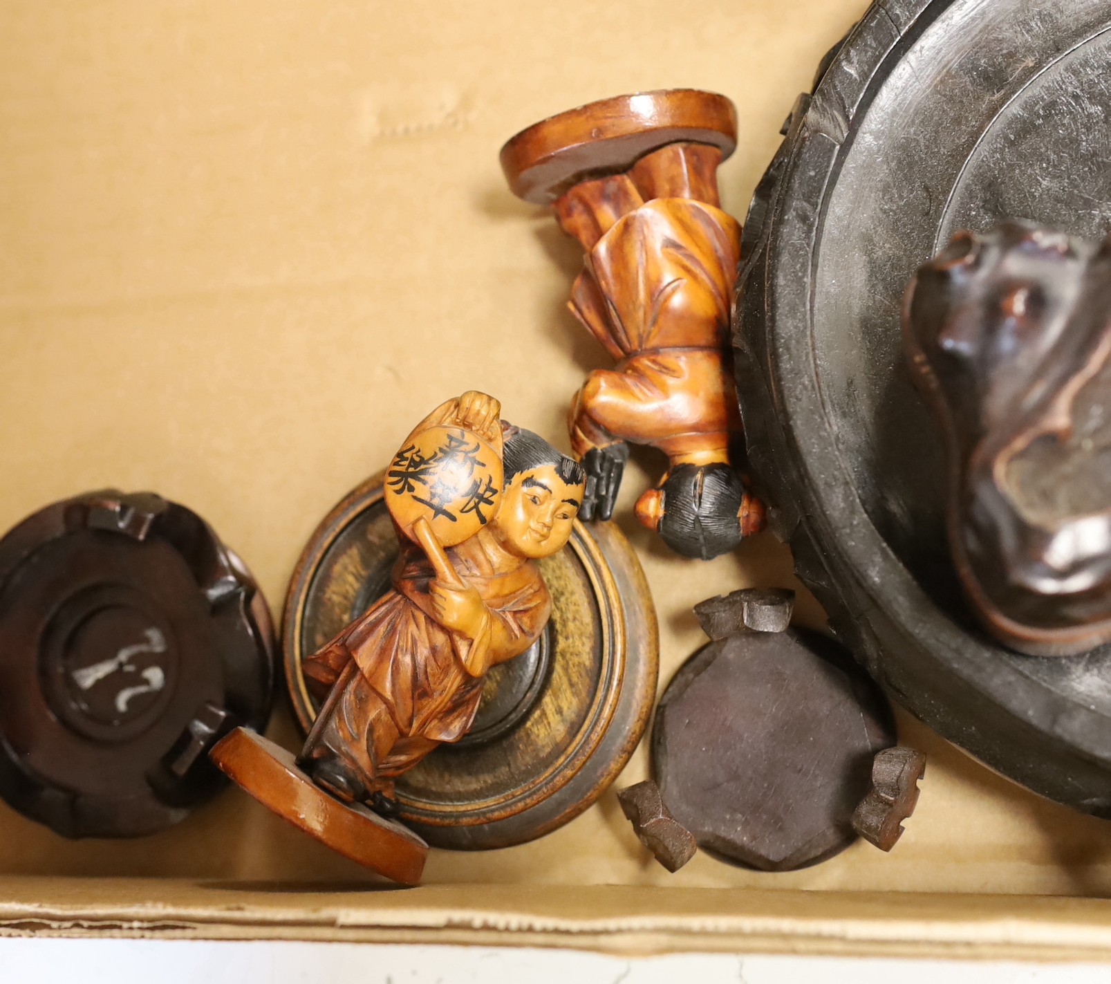 Chinese carved wooden ornaments, a pair of bamboo figures and various wood stands, etc, largest stand 35 cms diameter.